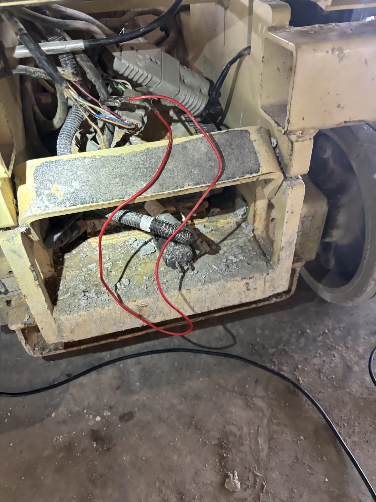 Battery compartment wiring repair on heavy equipment