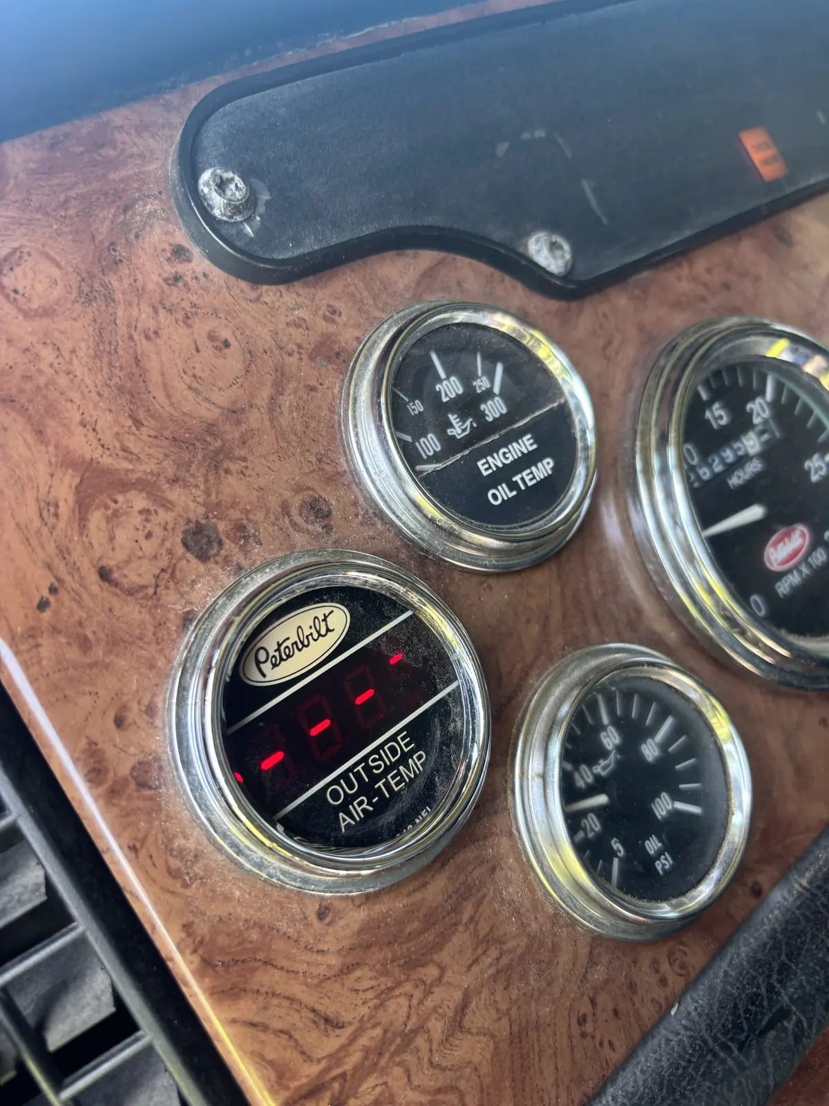 Semi truck dash gauge cluster inspected during a DOT compliance check
