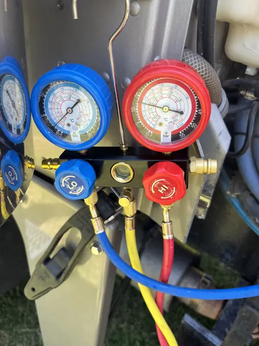 A/C system diagnostic manifold gauges connected for fleet AC repair