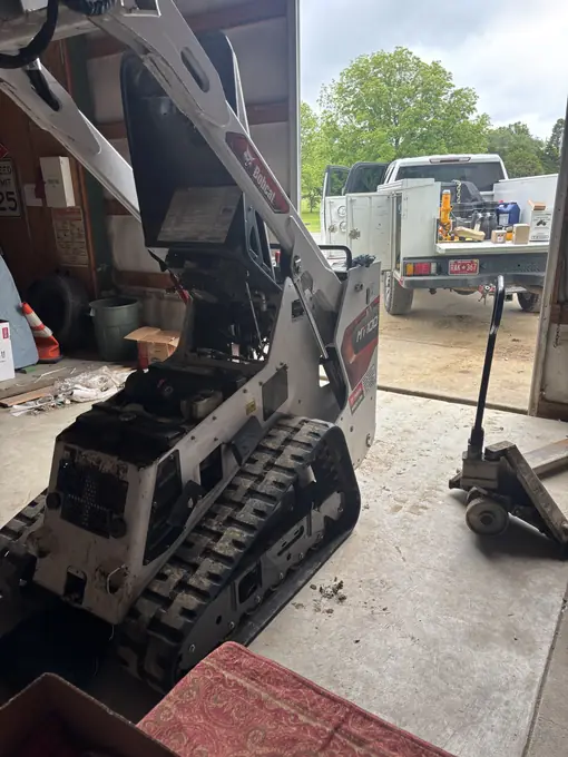 Bobcat mini track loader loaded for mobile repair dispatch
