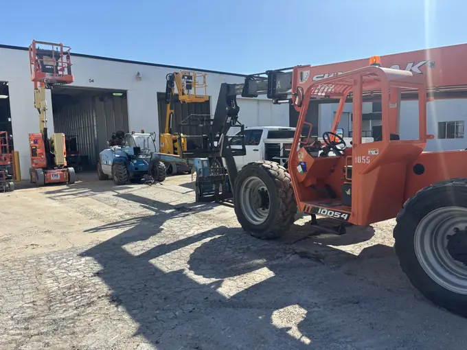 Boom lift and service trucks staged at the Tulsa Fleet Repair shop