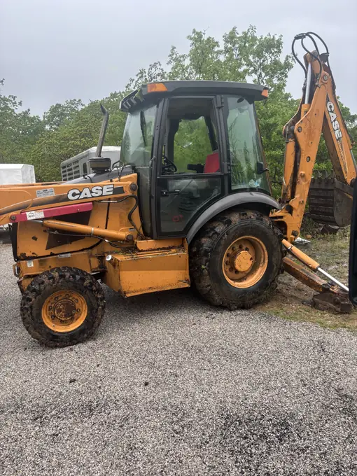 Case backhoe loader undergoing mobile repair