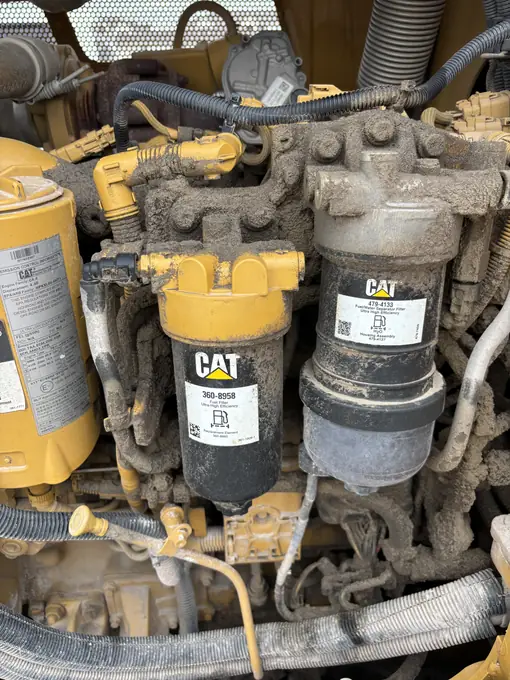 Close-up of CAT engine filters during diesel maintenance