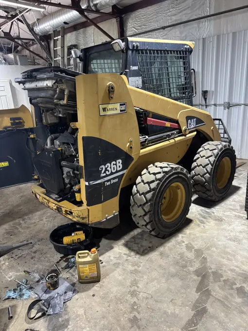 CAT skid steer loader in the indoor service bay