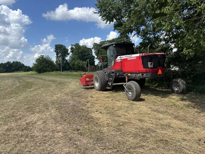 Combine harvester serviced in an Oklahoma field