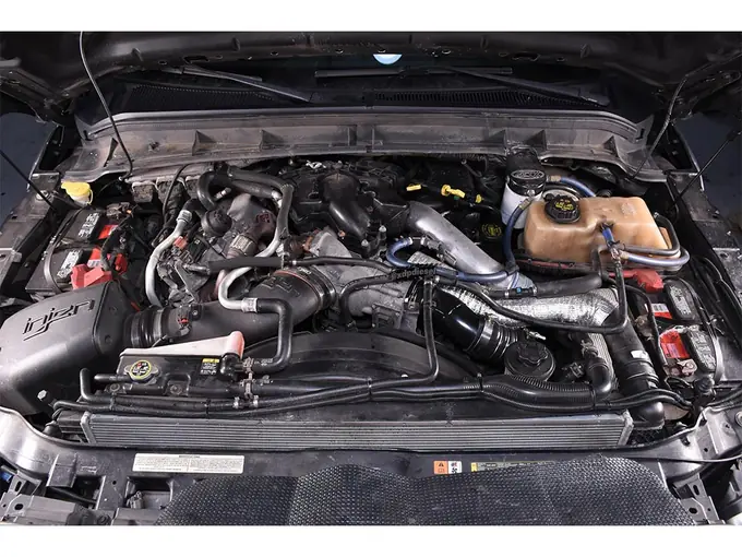 Ford 6.7L Powerstroke diesel engine bay during repair in Tulsa