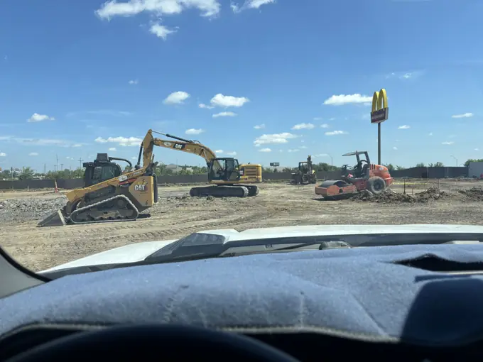 Heavy equipment fleet staged at a Tulsa-area jobsite