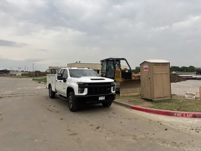 Mobile service truck dispatched to a commercial parking lot repair