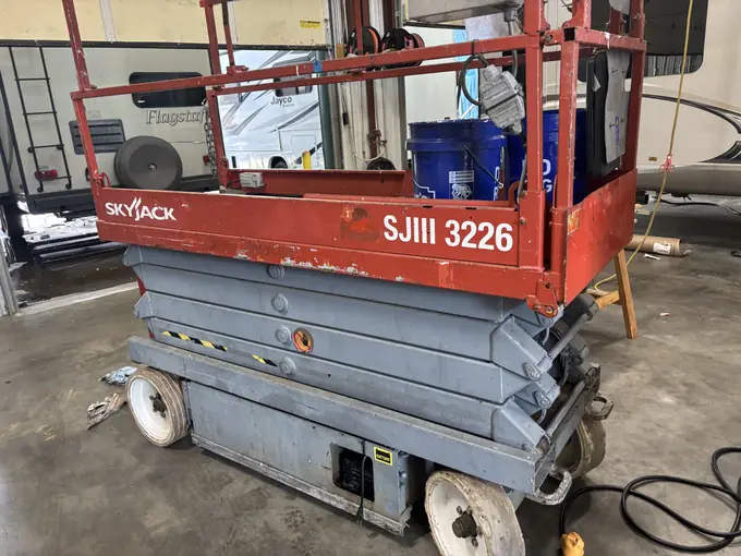 SkyJack scissor lift undergoing shop repair