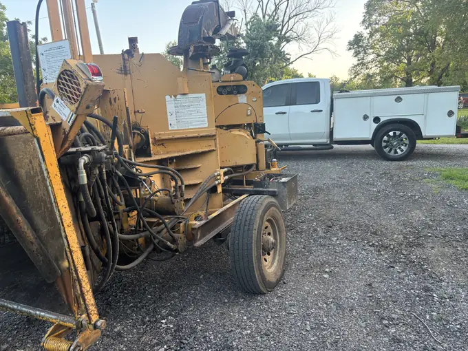Stump grinder and mobile service truck at golden hour