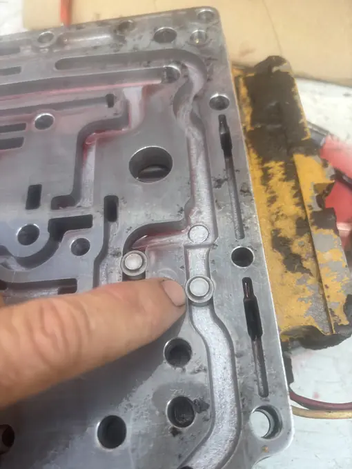 Technician diagnosing a transmission valve body