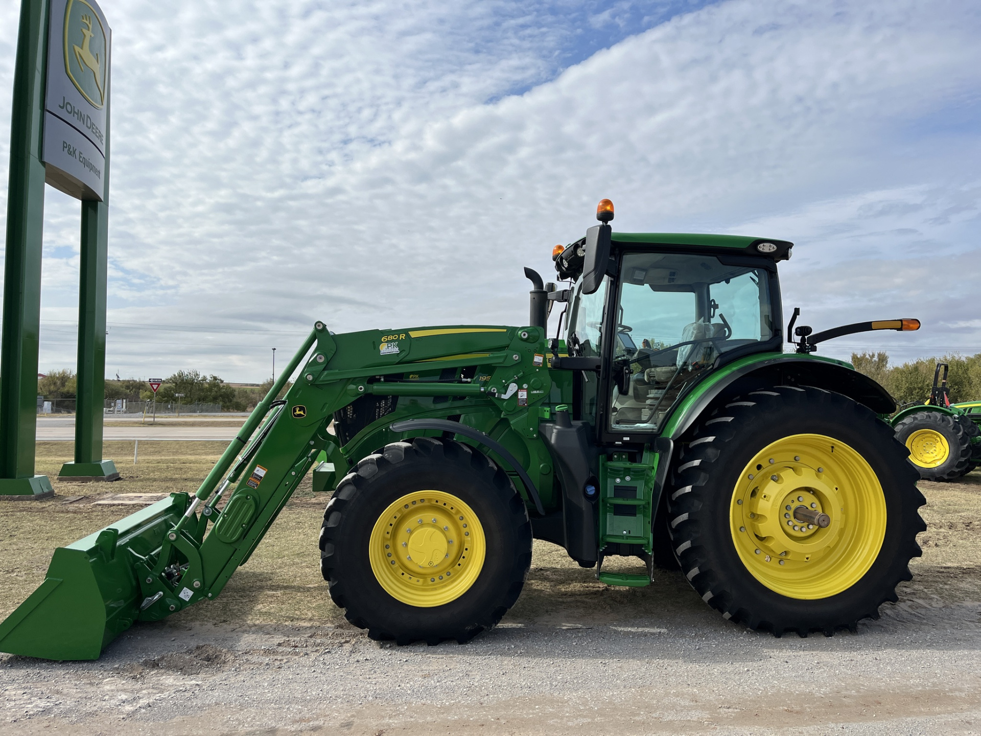 John Deere 6R Series tractor with front loader attachment